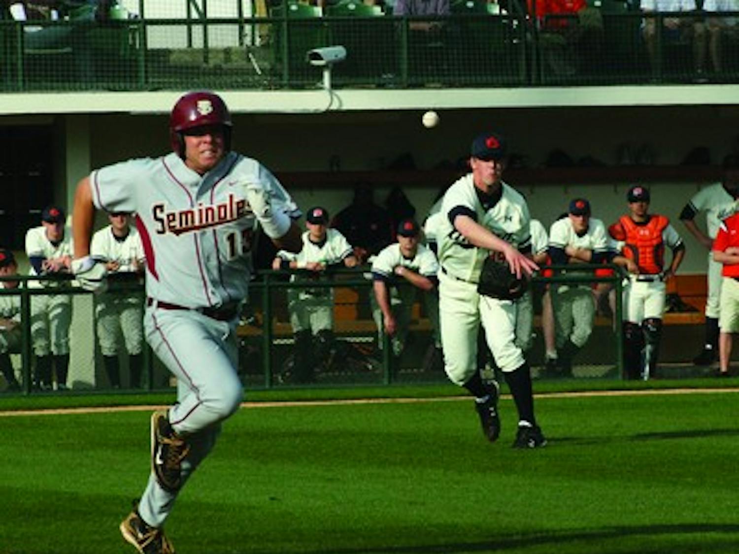 Freshman Jon Luke Jacobs throws out Florida State's Jason Stidham during Saturday's game. Auburn won 10-9, the Seminole's first loss.