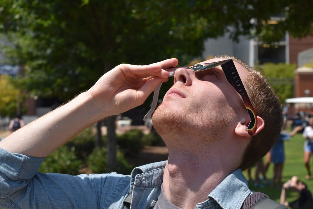 R.J. Harris, senior in architecture, takes a look at the eclipse.z