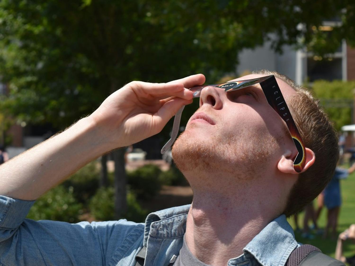 R.J. Harris, senior in architecture, takes a look at the eclipse.z