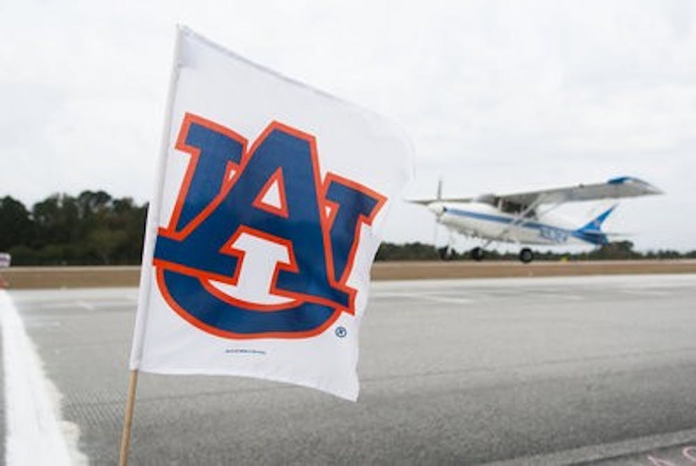 A War Eagle Flying Team member lands their plane during the Power-off Landing event. The team placed first in the Flying Event Team Champions, Regional Safety Award and Regional Sportsmanship Award.