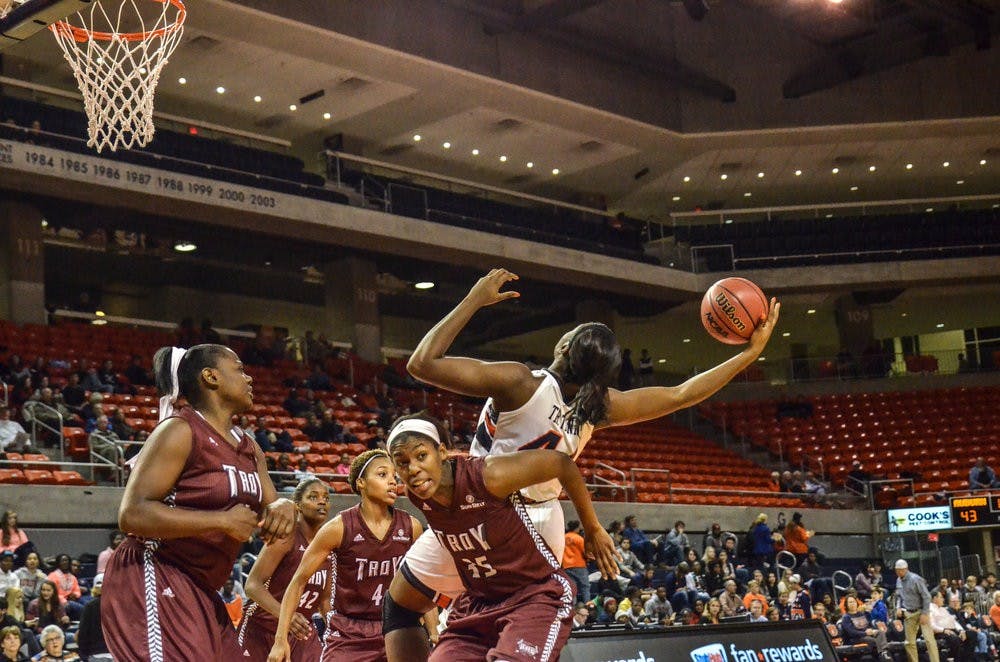 Tra'Cee Tanner reaches out for a rebound.

Raye May / PHOTO EDITOR