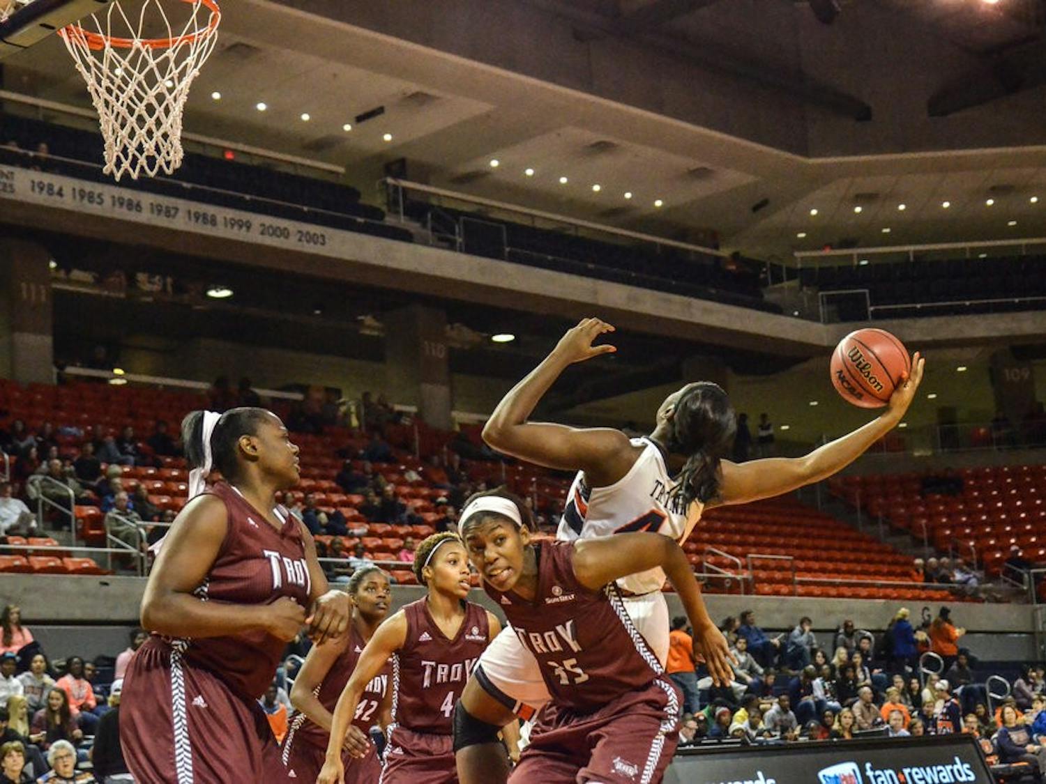 Tra'Cee Tanner reaches out for a rebound.
Raye May / PHOTO EDITOR