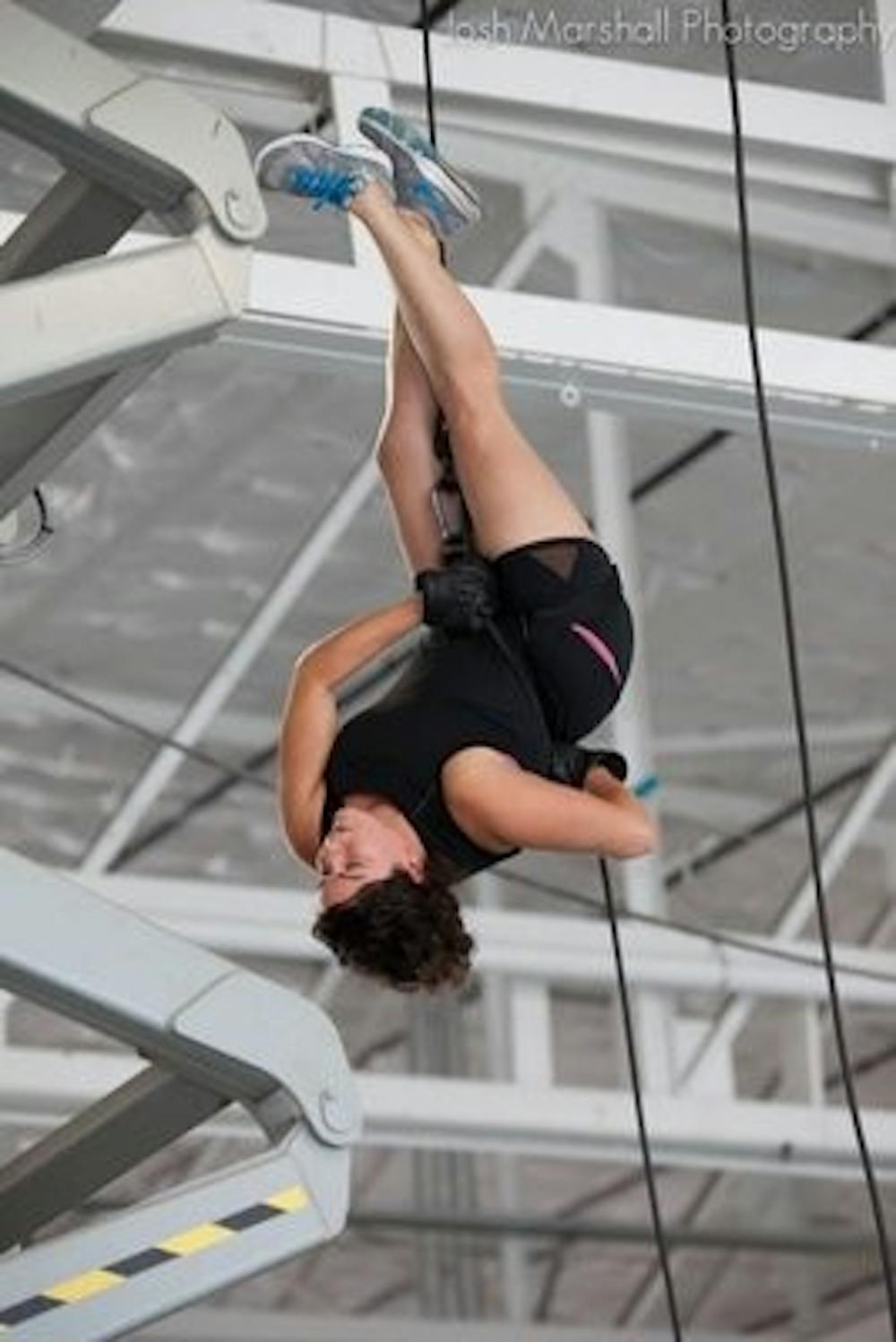 Grilli hangs in the air while performing a repelling stunt in Seattle last summer. (Photo contributed by Josh Marshall)