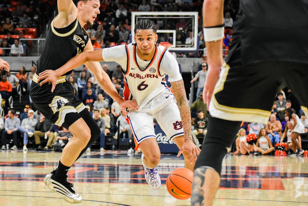 <p>Elyjah Freeman (6) dribbles ball down the court against Wofford in Neville Arena on November 11, 2025.</p>