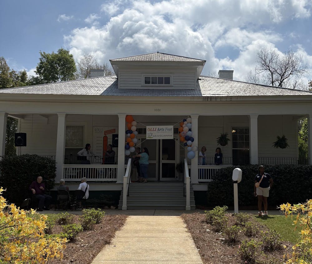 People congregate around the entrance of Olli's Arts Fest.