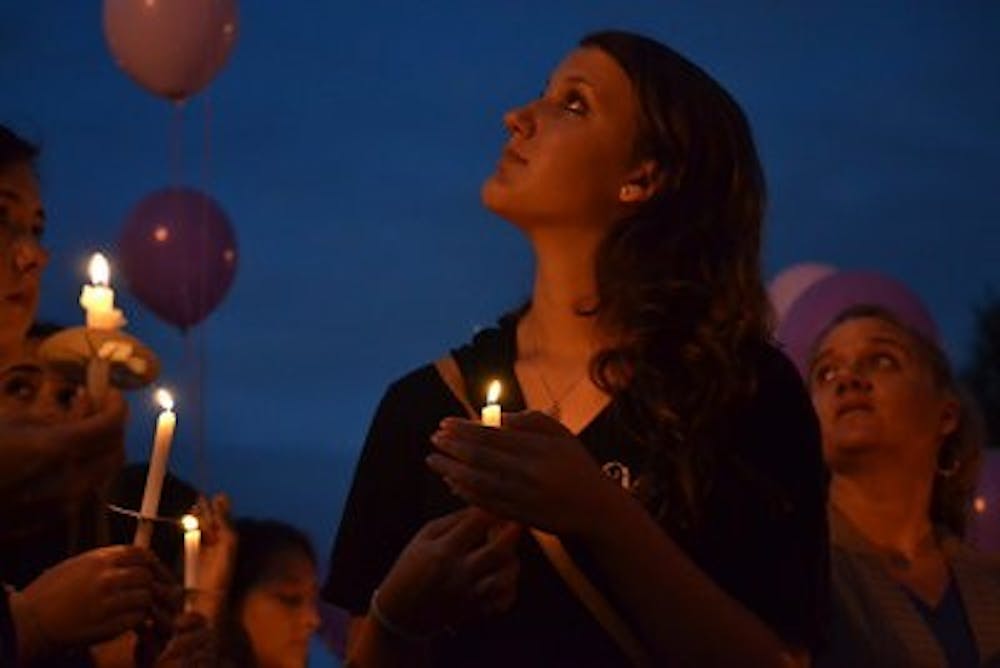 Alexa Combs, Alpha Chi Omega member and sophomore in business, watched the balloons dedicated to domestic abuse victims be released from Cater Lawn Tuesday, Oct. 15.