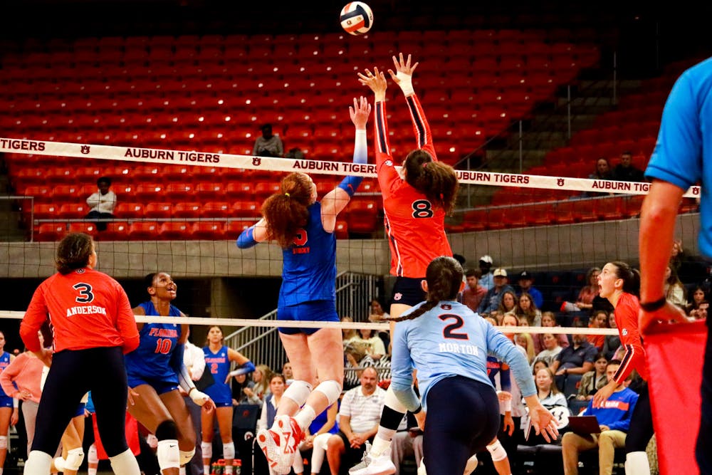 <p>Kendal Kemp (#8) and Florida (#5) fight for the ball during Auburn volleyball versus Florida at Neville Arena on Oct. 26, 2022.</p>