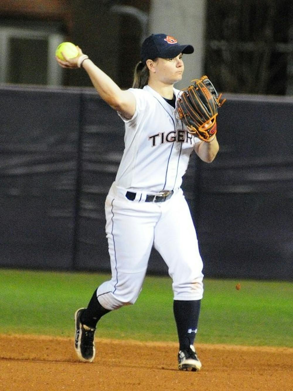 Emily Carosone #5 throws to first base for the third out of the inning. Auburn vs UTC in Auburn, AL on Feb. 8, 2015. Adam Sparks | Photographer
