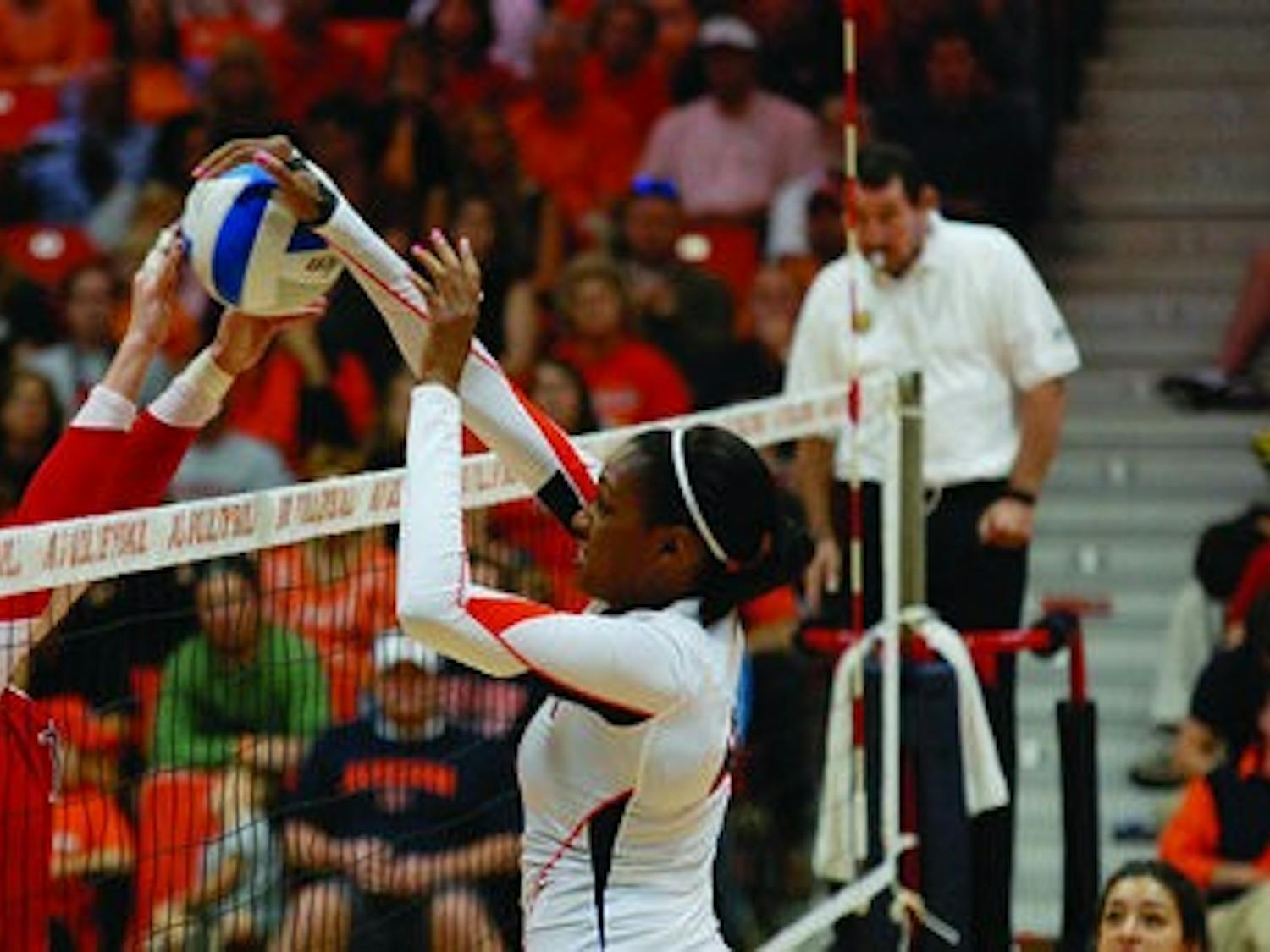 Senior middle blocker Alyssa Davis blocks a shot during Sunday's game against Ole Miss. (Charlie Timberlake / ASSISTANT PHOTO EDITOR)
