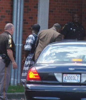 Desmonte Leonard is escorted into the Lee County Justice Center Wednesday afternoon for his preliminary hearing regarding the June 9 shooting. (Zeke Turrentine / COMMUNITY BEAT REPORTER)