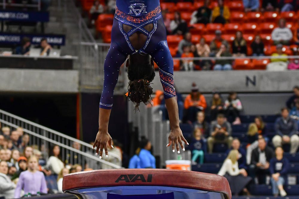 Auburn Gymnast Ananda Brown vaults during the gymnastics preview meet in Neville Arena on Dec. 16, 2022.