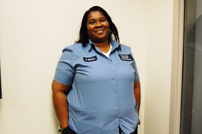 On a typical work day, Karen Spencer keeps the halls of the pharmacy building clean by day and sews and spends time with her dogs by night. (Lindsay Rife / Associate Intrigue Editor)