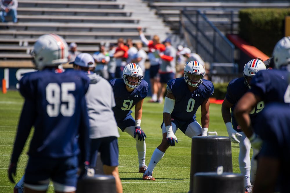 Owen Pappoe (0) waits to run a drill during Auburn Footballs Open Spring Practice, on Sunday, March 21,  2021, in Auburn, Ala.
