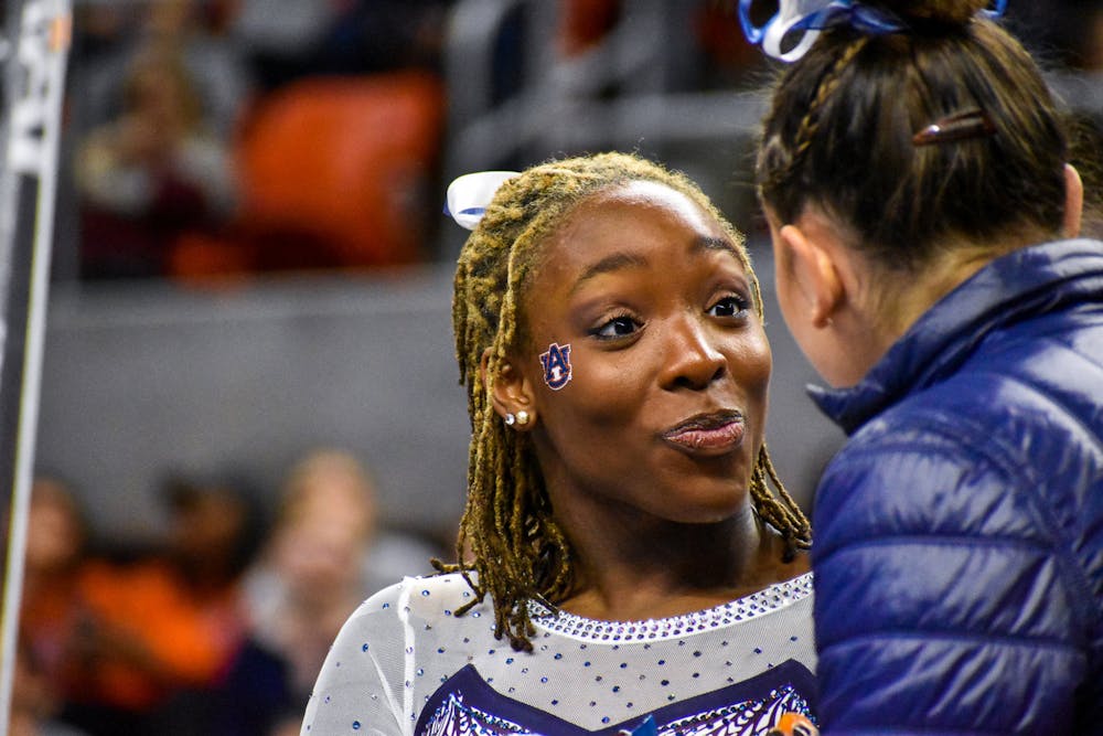<p>Aria Brusch reacts during a gymnastics meet between Auburn and Kentucky in Neville Arena on Feb. 25.</p>