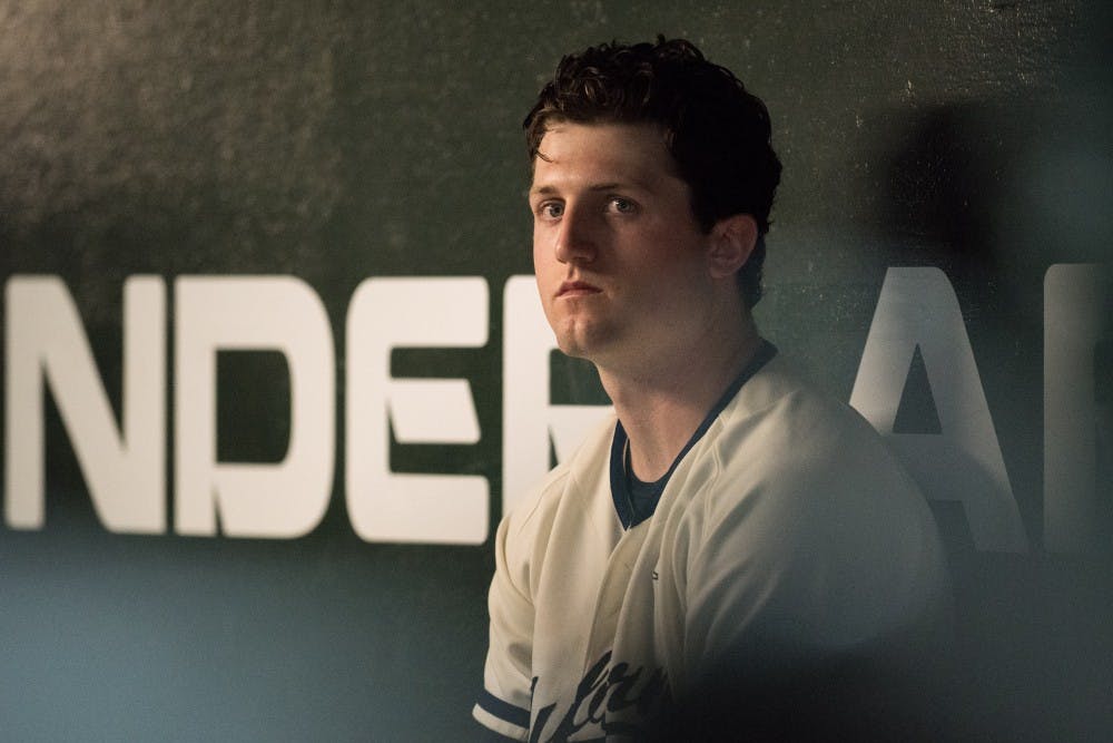 Casey Mize sits in the dugout during Auburn vs. Vanderbilt baseball on Friday, May 4, 2018, in Auburn, Ala.