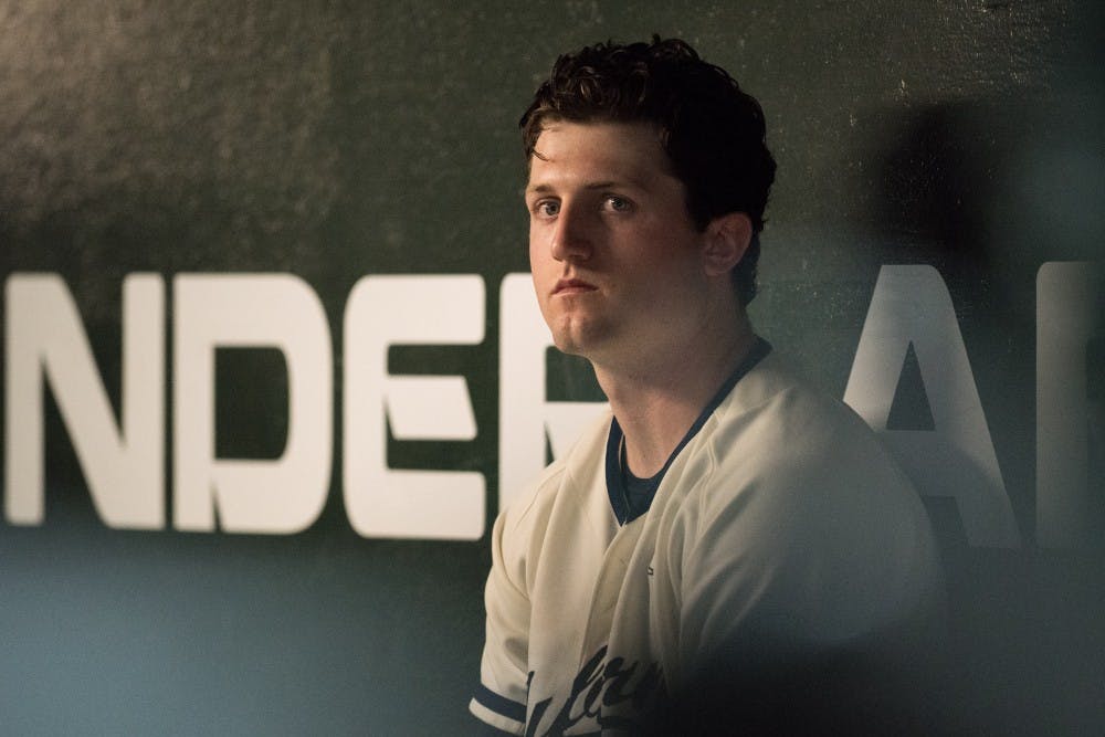 <p>Casey Mize sits in the dugout during Auburn vs. Vanderbilt baseball on Friday, May 4, 2018, in Auburn, Ala.</p>