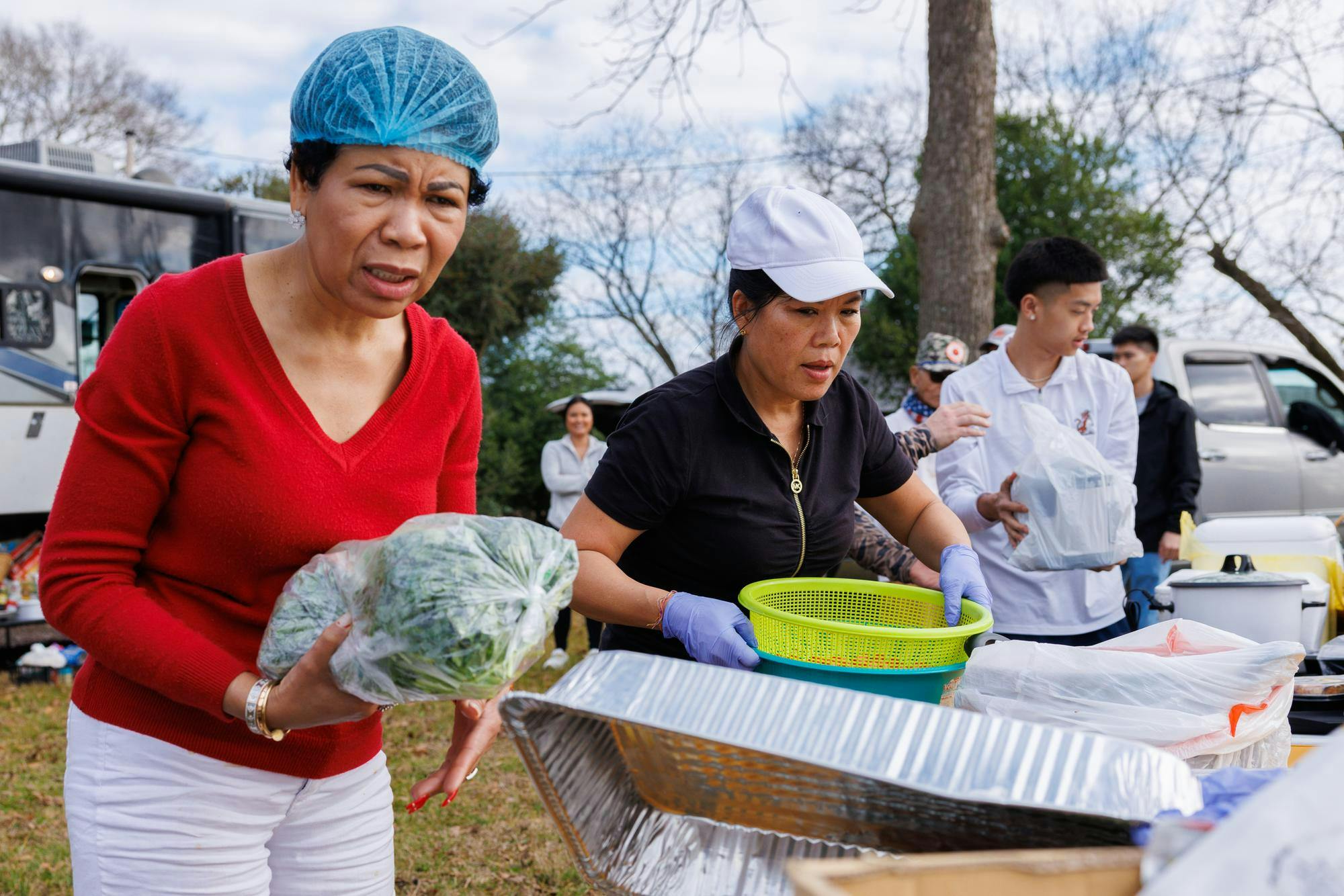 Volunteers race to set up tables of food before the arrival of the monks. Many work on a four to five day rotation before switching with another group. To become a volunteer, interested supporters will reach out to the organization and send in their availability. They will later be contacted and a plan will be placed into action.