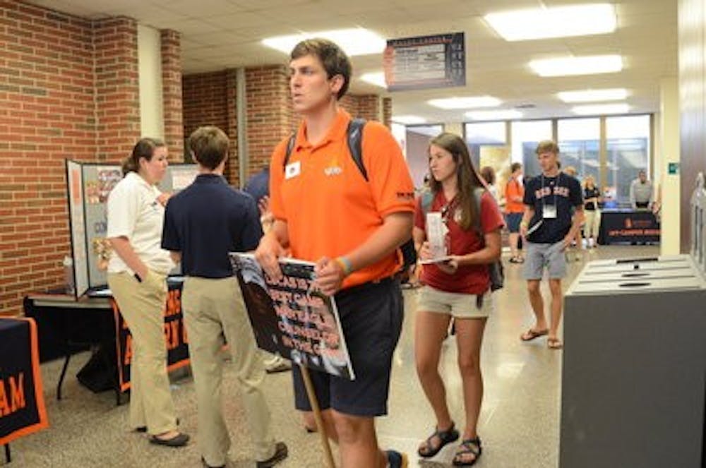 Counselors guide campers around booths in the Haley Center. (Raye May | Photo & Design Editor)
