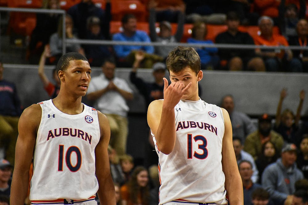 <p>Dec. 1, 2021; Auburn, Alabama; Jabari Smith (10) and Walker Kessler (13) share thoughts during a match between Auburn and UCF in the Auburn Arena.</p>
