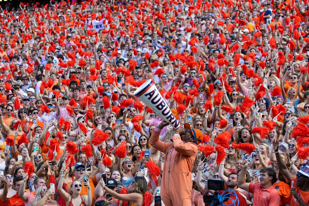 Cam Newton gets the student section hyped during the first quarter of Georgia at Auburn