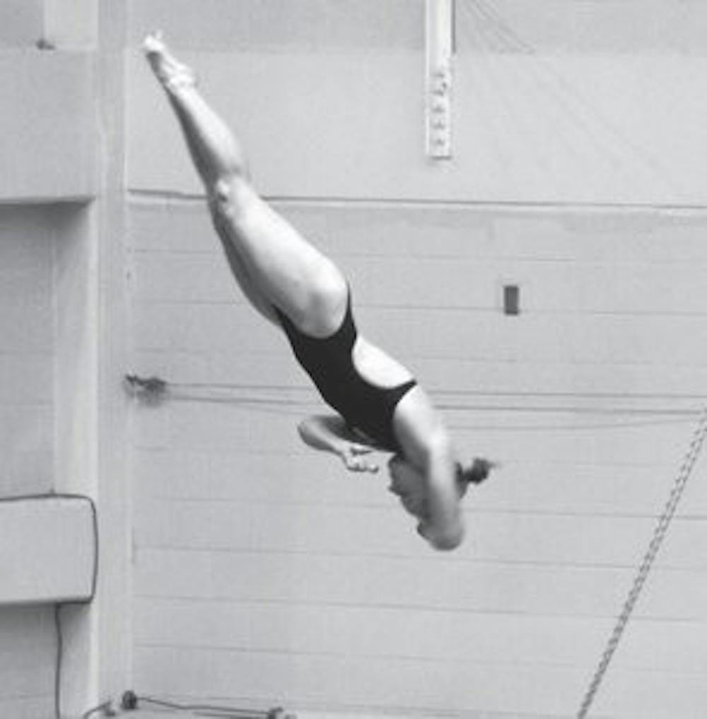 Shanna Schuelein dives against LSU Saturday, Oct. 20. (Katherine McCahey / PHOTOGRAPHER)