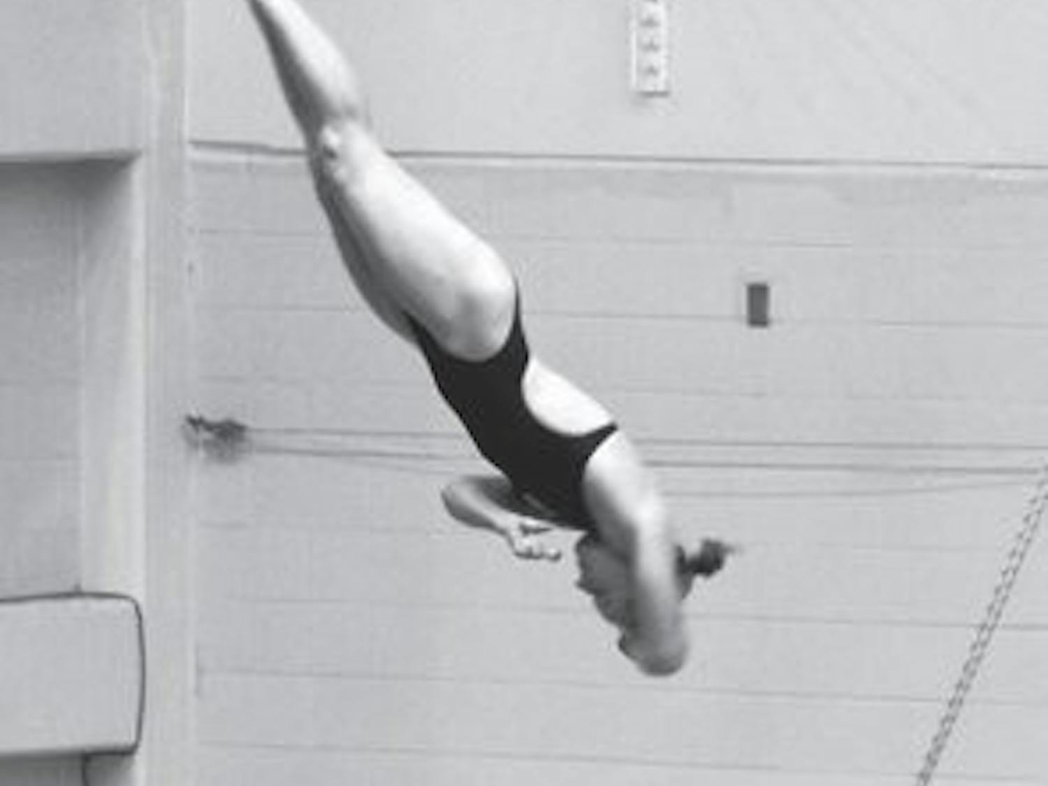 Shanna Schuelein dives against LSU Saturday, Oct. 20. (Katherine McCahey / PHOTOGRAPHER)