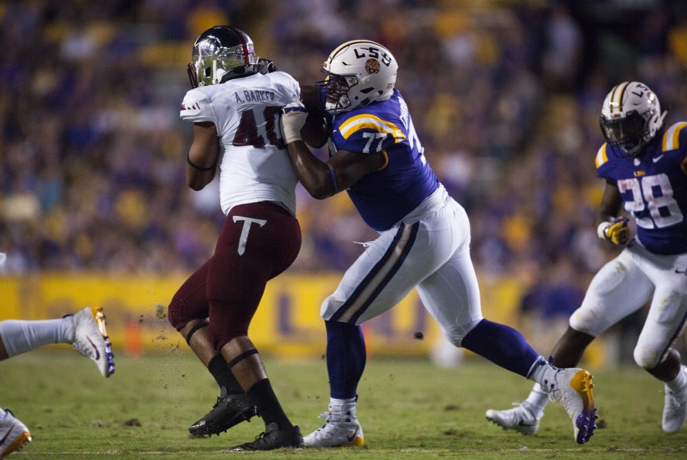 <p>LSU freshman offensive lineman Saahdiq Charles (77) attemps to block during Tigers’ 24-21 loss against Troy on Saturday, Sept. 30, 2017, in Tiger Stadium. &nbsp;Photo courtesy of Alyssa Berry / The Daily Reveille. &nbsp;</p>