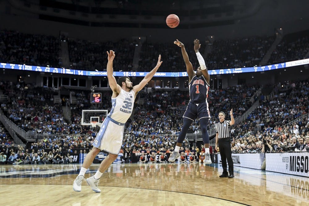 <p>Jared Harper (1) shoots the ball during Auburn men's basketball vs North Carolina on Friday, March 29, 2019, in Kansas City, Mo.</p>