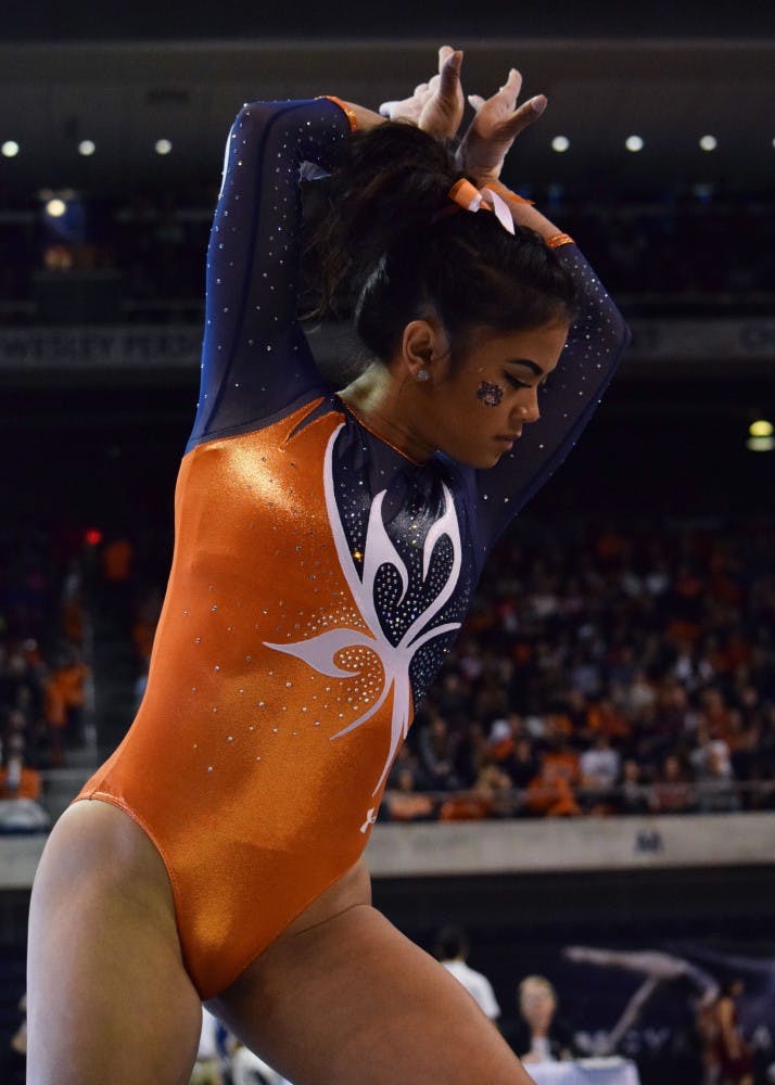 M.J. Rott strikes her pose at the beginning of&nbsp;her floor routine.&nbsp;Alabama vs Auburn in Auburn, Ala. on Friday, Feb. 12, 2016.