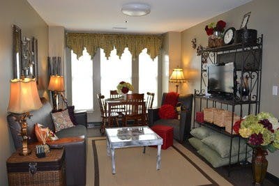 Kathryn Boswell and her roommates decorate the common area of their dorm in the Village with styles inspired by Southern Living magazine. They used reds, greens, browns and plum shades for their color scheme. (Raye May / INTRIGUE EDITOR)