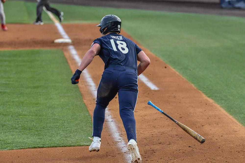 Auburn catcher Ike Irish (18) runs for first base in a home opener against Indiana in Plainsman Park on Feb. 17, 2023.