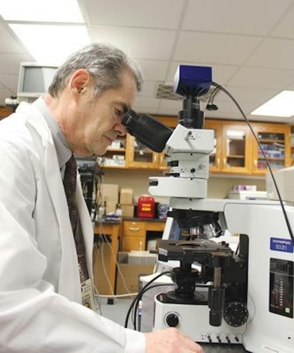 Vitaly Vodyadoy conducts research using his superpowerful microscope in the lab at Green Hall. (ALEX SAGER / PHOTO EDITOR)