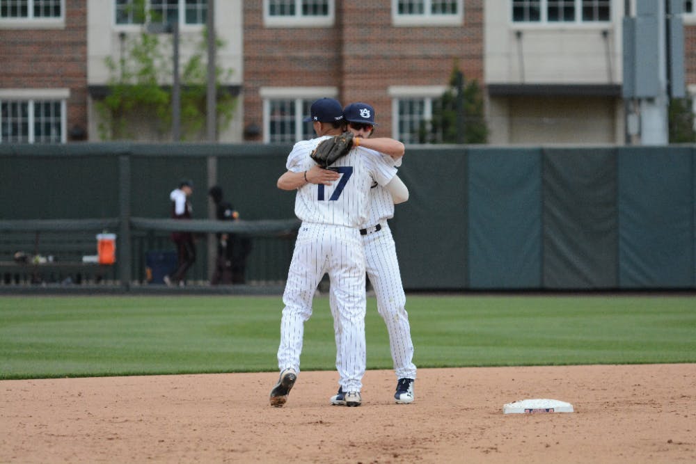 Will Holland (17) and Jay Estes celebrates Auburn's 7-5 win&nbsp;during Auburn baseball vs. Mississippi State on April 15, 2018, in Auburn, Ala.