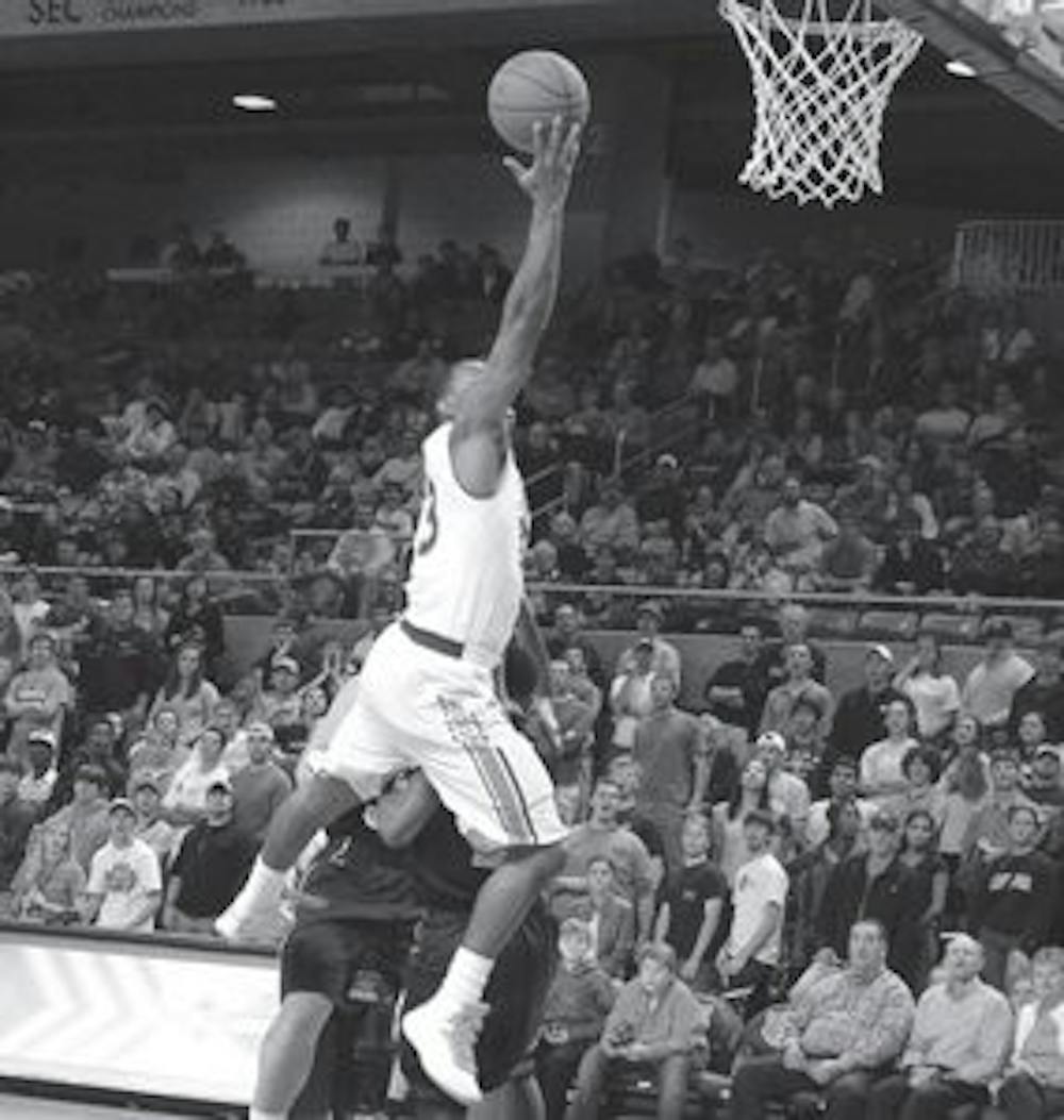 Senior guard Frankie Sullican soars over Georgia State defenders in Auburn's exhibition win Monday, Nov. 5. (Emily Morris / ASSISTANT PHOTO EDITOR)