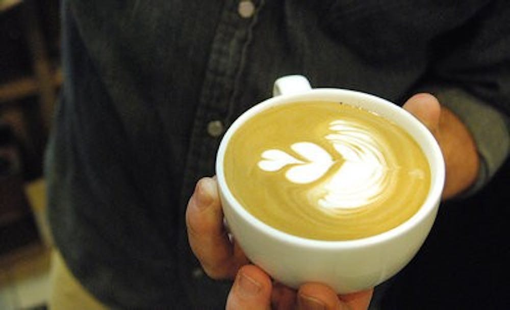 Owner Wade Preston prepares a latte. (Photo by: Emily Enfinger)
