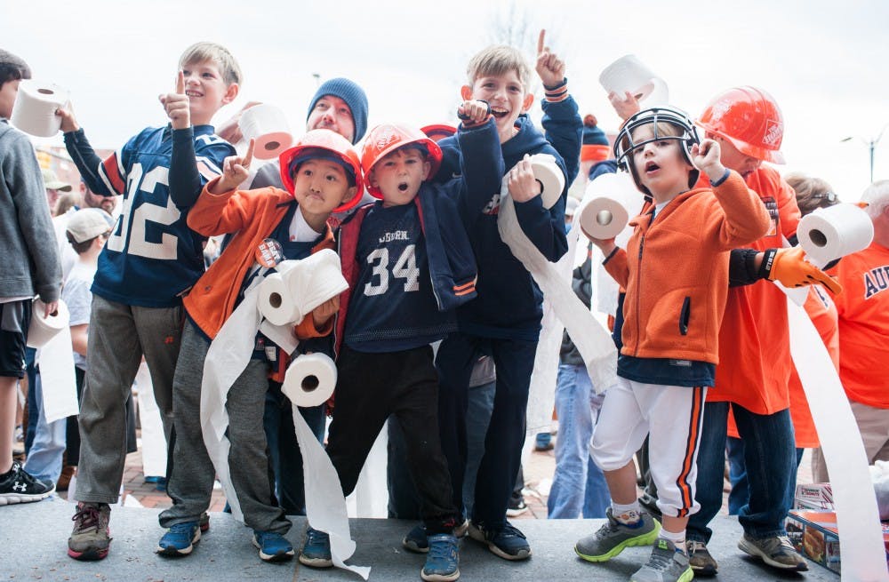 <p>Young fans gather at Toomer's Corner for a rolling demonstration at the start of College Gameday. Auburn vs Alabama on Saturday, Nov. 25 in Auburn, Ala.</p>