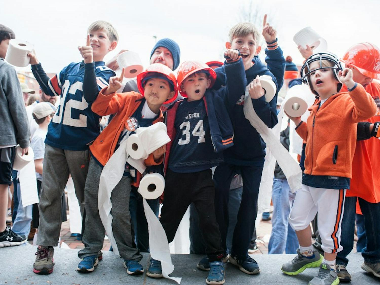 Young fans gather at Toomer's Corner for a rolling demonstration at the start of College Gameday. Auburn vs Alabama on Saturday, Nov. 25 in Auburn, Ala.