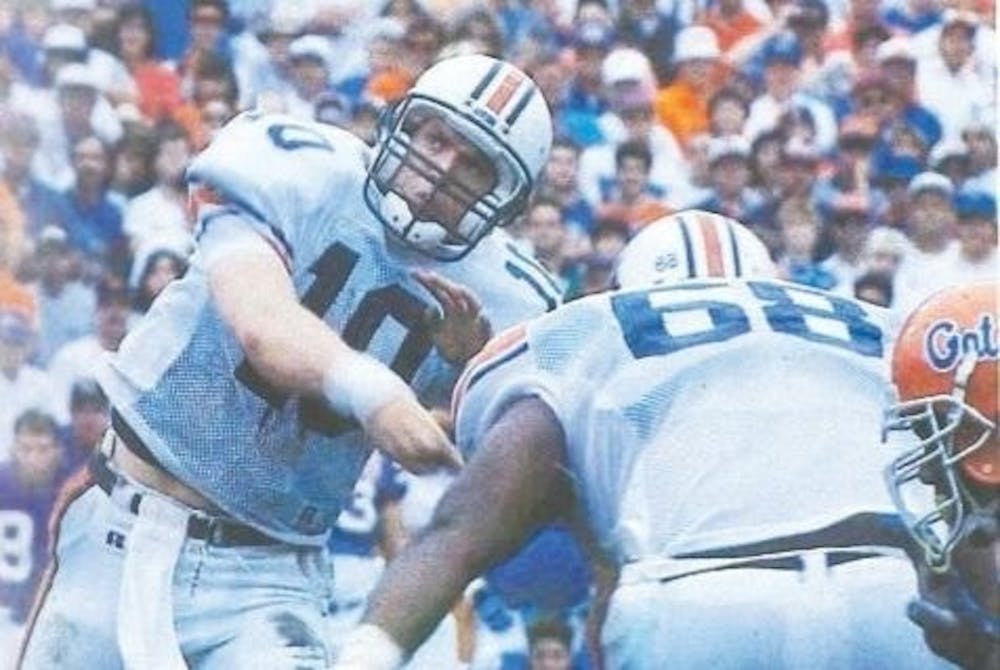 <p>Pat Nix (10) throws a pass during Auburn at Florida. Photo via 1995 edition of The Glomerata, Auburn's annual yearbook.</p>