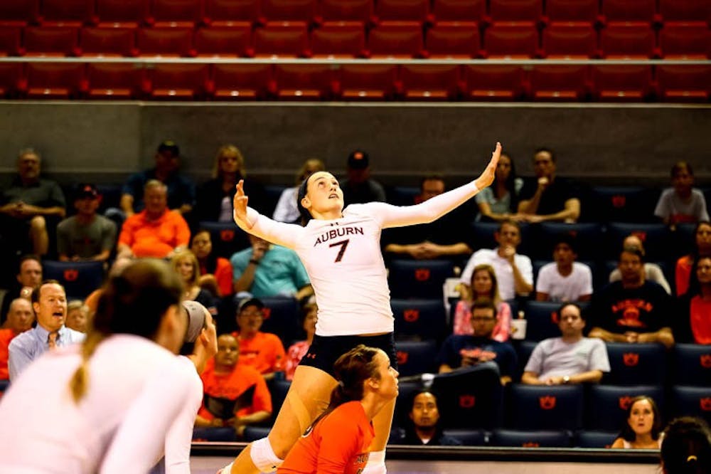 Courtney Crable (#7) jumping to hit the ball. (Kenny Moss | Photographer)