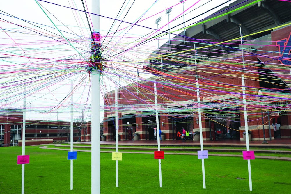 <p>The Unity Project consisted of 32 poles on the Green Space that were labelled with identities for students to connect with yarn.</p>