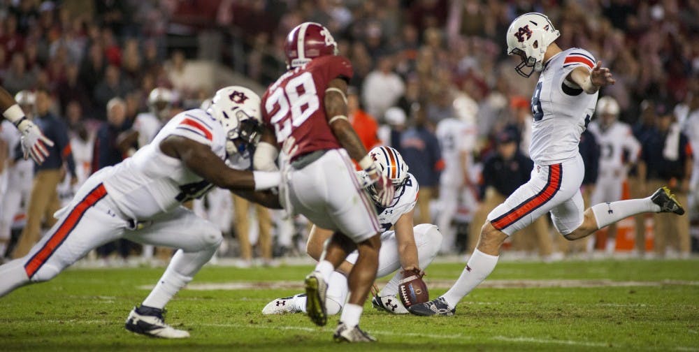 Daniel Carlson (38) kicks his fourth field goal of the game. Auburn vs Alabama on Saturday, Nov. 26 in Tuscaloosa, AL.