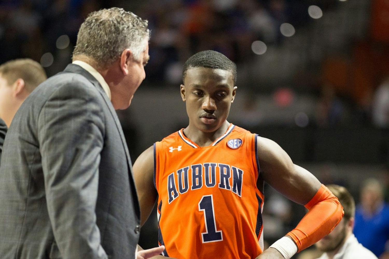 Jared Harper (1) listens to Head Coach Bruce Pearl during a timeout&nbsp;during Auburn basketball vs. Florida on Saturday, Feb. 24, 2018, in Gainesville, Fla. 