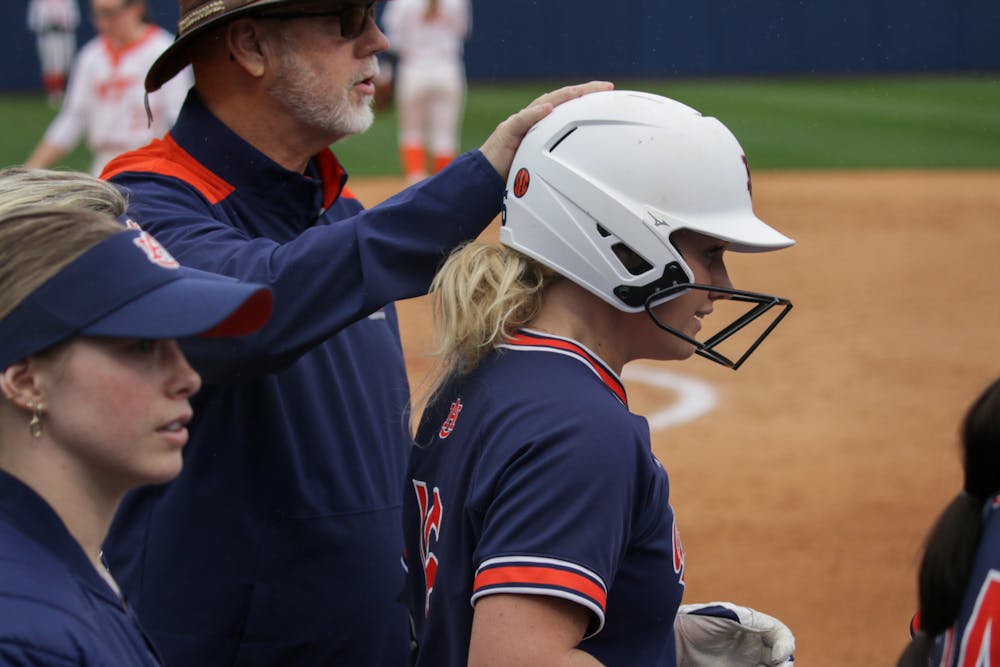 <p>Coach Mickey Dean congratulating KK McCrary (#16) for her homerun against Virginia Tech at Jane B. Moore Field on February 10th 2024</p>