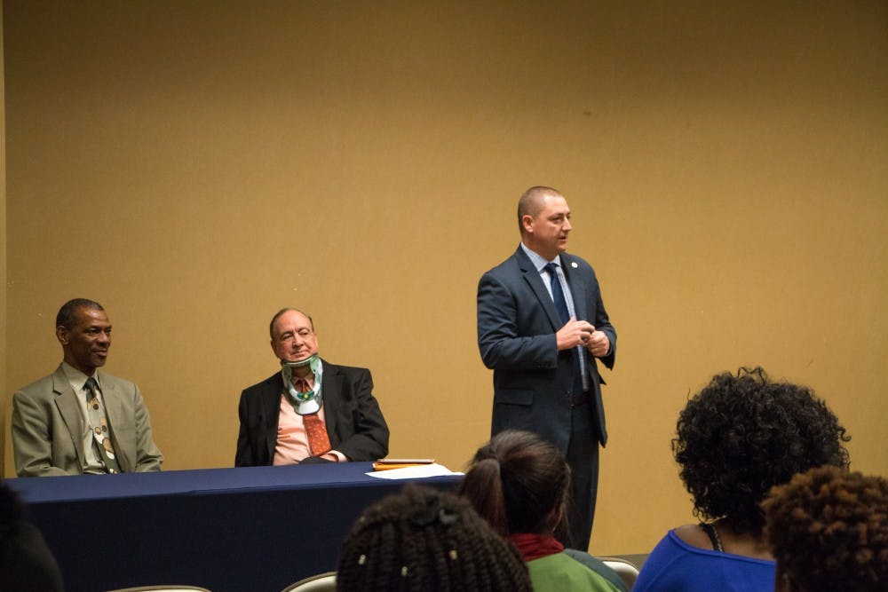 President&nbsp;Gogue had neck surgery over winter&nbsp;break and wore a neck brace to the address.&nbsp;He&nbsp;assured students&nbsp;he was not in any pain, however, so they should "feel free to holler at him."