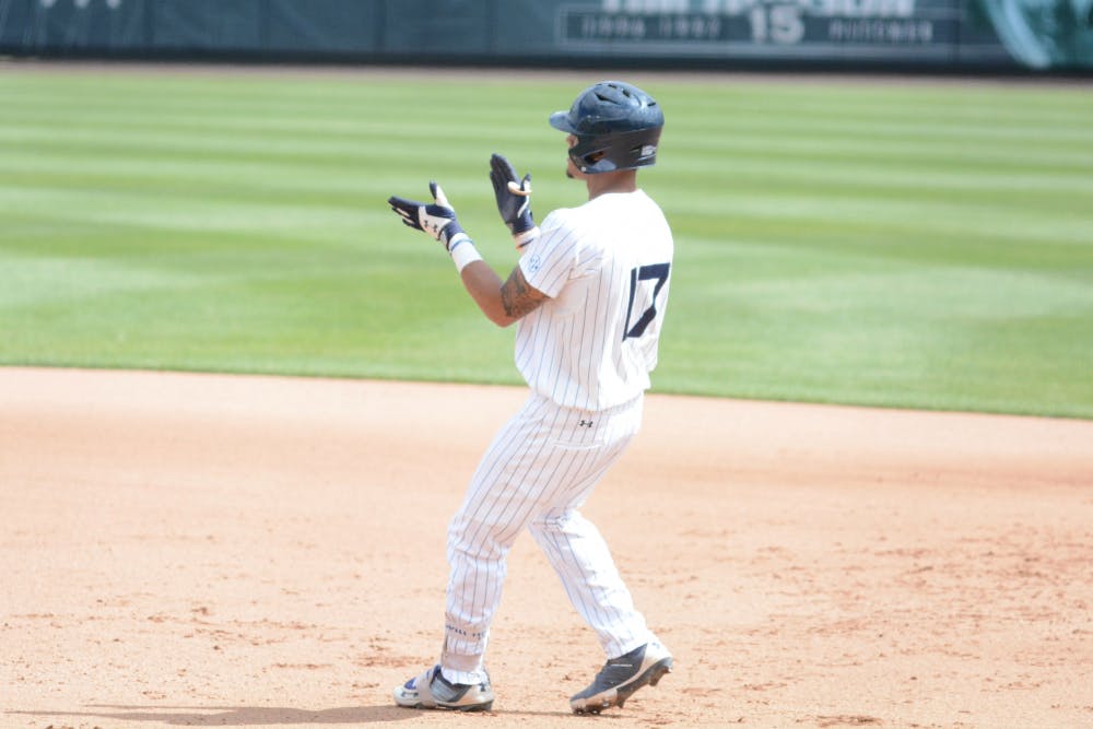 Will Holland (17) celebrates a single&nbsp;during Auburn baseball vs. Mississippi State on April 15, 2018, in Auburn, Ala.