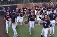 Auburn's team circles Hitchcock Field after winning their Regional, doffing caps to celebrating fans and family throughout the facility.&nbsp;