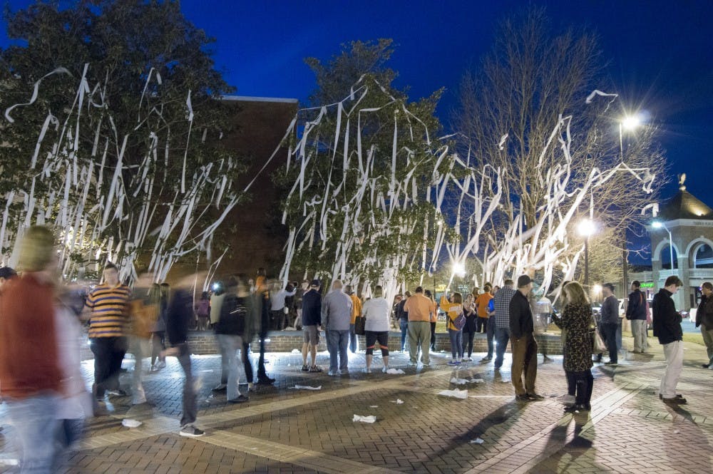 Auburn basketball fans at Toomer's Corner after Auburn's victory over Kentucky at the Auburn Arena on Saturday, Jan. 16, in Auburn, Ala. Auburn won 75-70. 