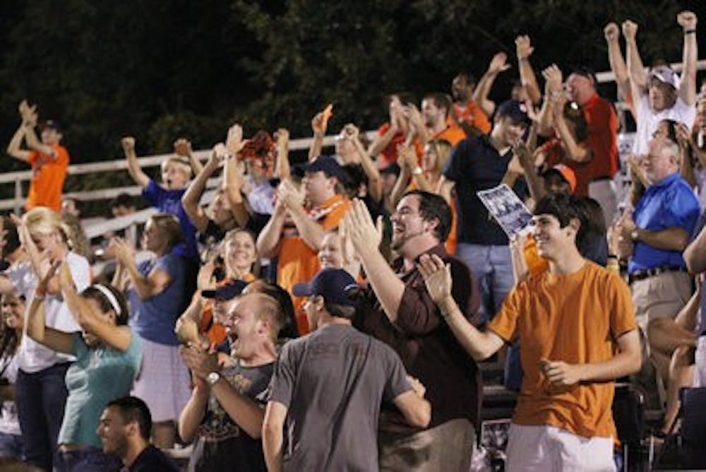 Fans cheer on the Auburn soccer team Friday night at the "Cram the Complex" event. The team beat Florida State 3-2 in double overtime. The team plays in Los Angeles tomorrow. (Emily Adams / PHOTO EDITOR)