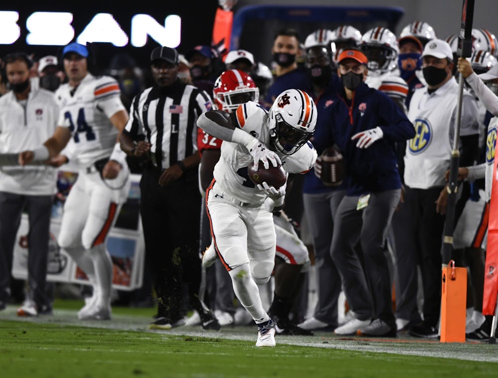<p>Oct 3, 2020; Athens, GA, USA; Tank Bigsby (4) runs the ball in the first quarter during the game between Auburn and Georgia at Samford Stadium. Todd Van Emst/AU Athletics</p>