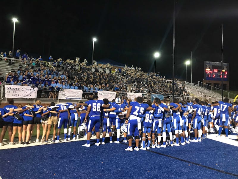 Auburn High football players, band members and students sing the alma mater after the team's victory over Park Crossing on Friday, Aug. 20, 2021, in Auburn, Ala.